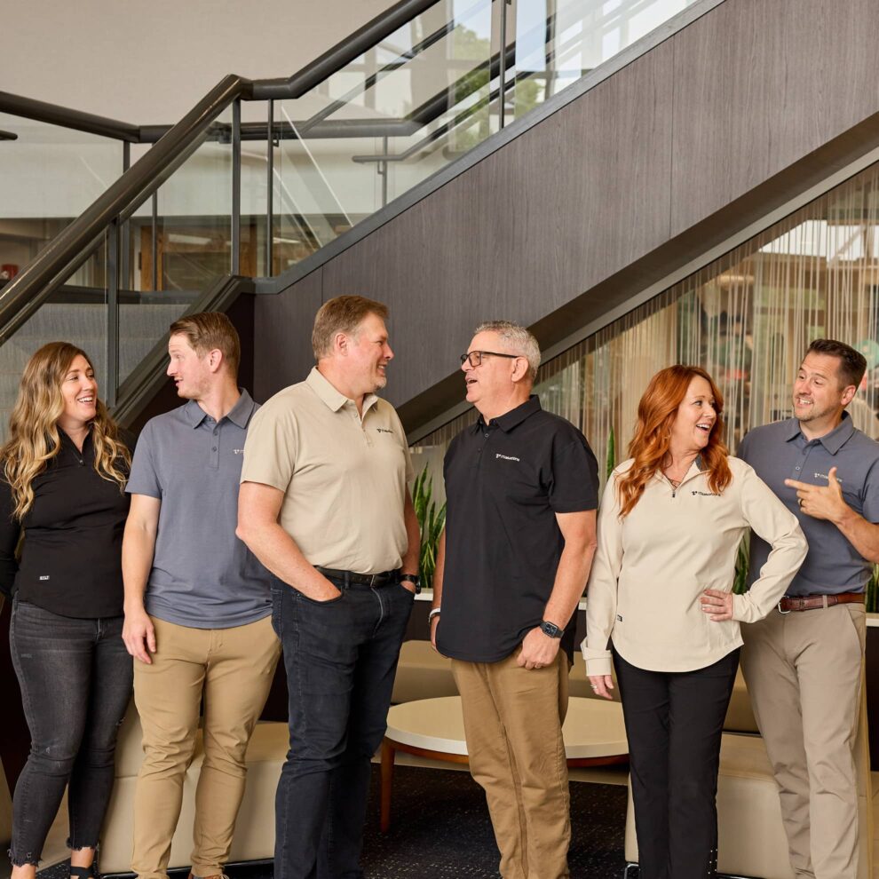 iTValuations Team Members Standing in Lobby